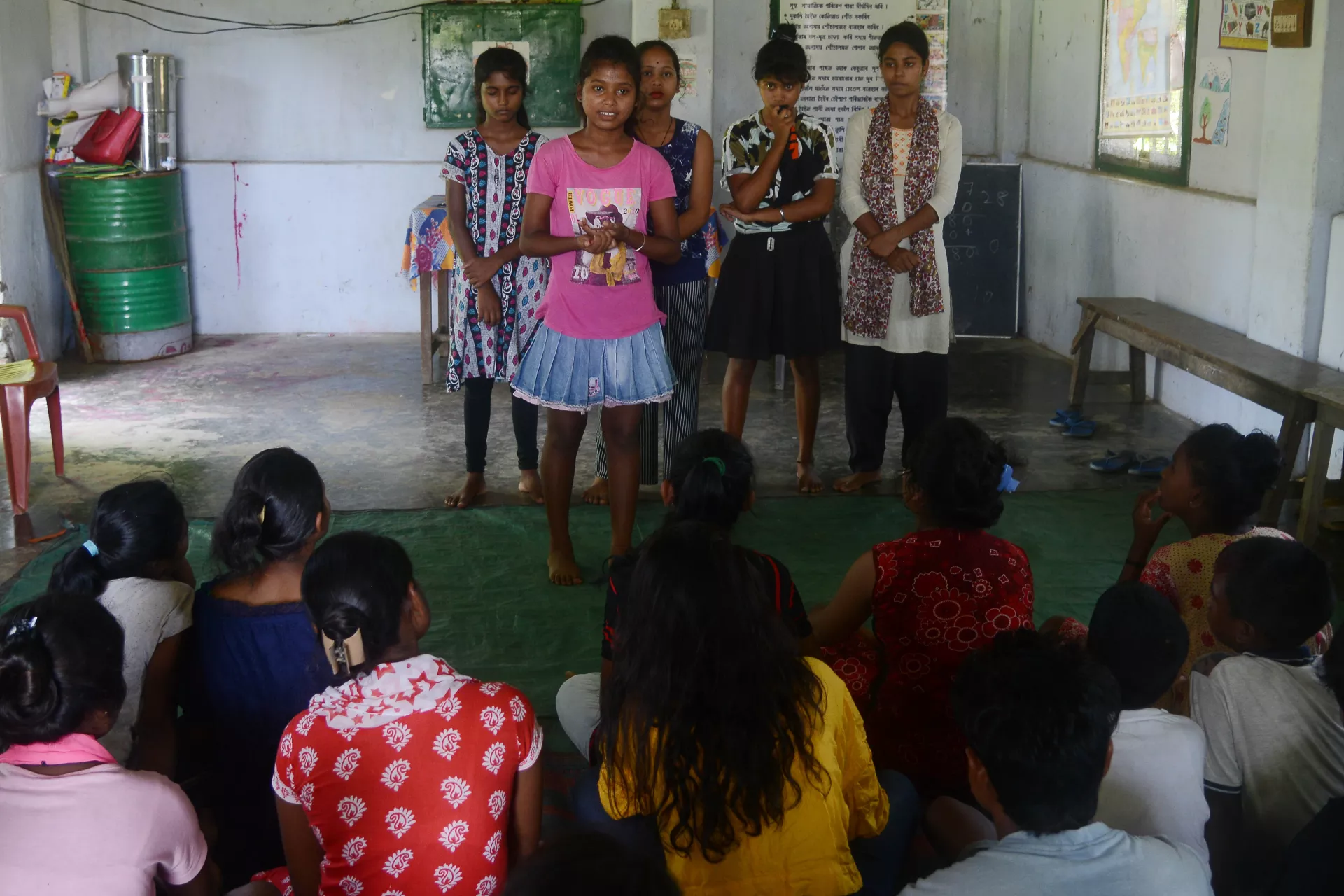 Members of the Prerona Adolescent Girls club of Muttuck Tea Estate performing a awareness song and dance against child marriage.