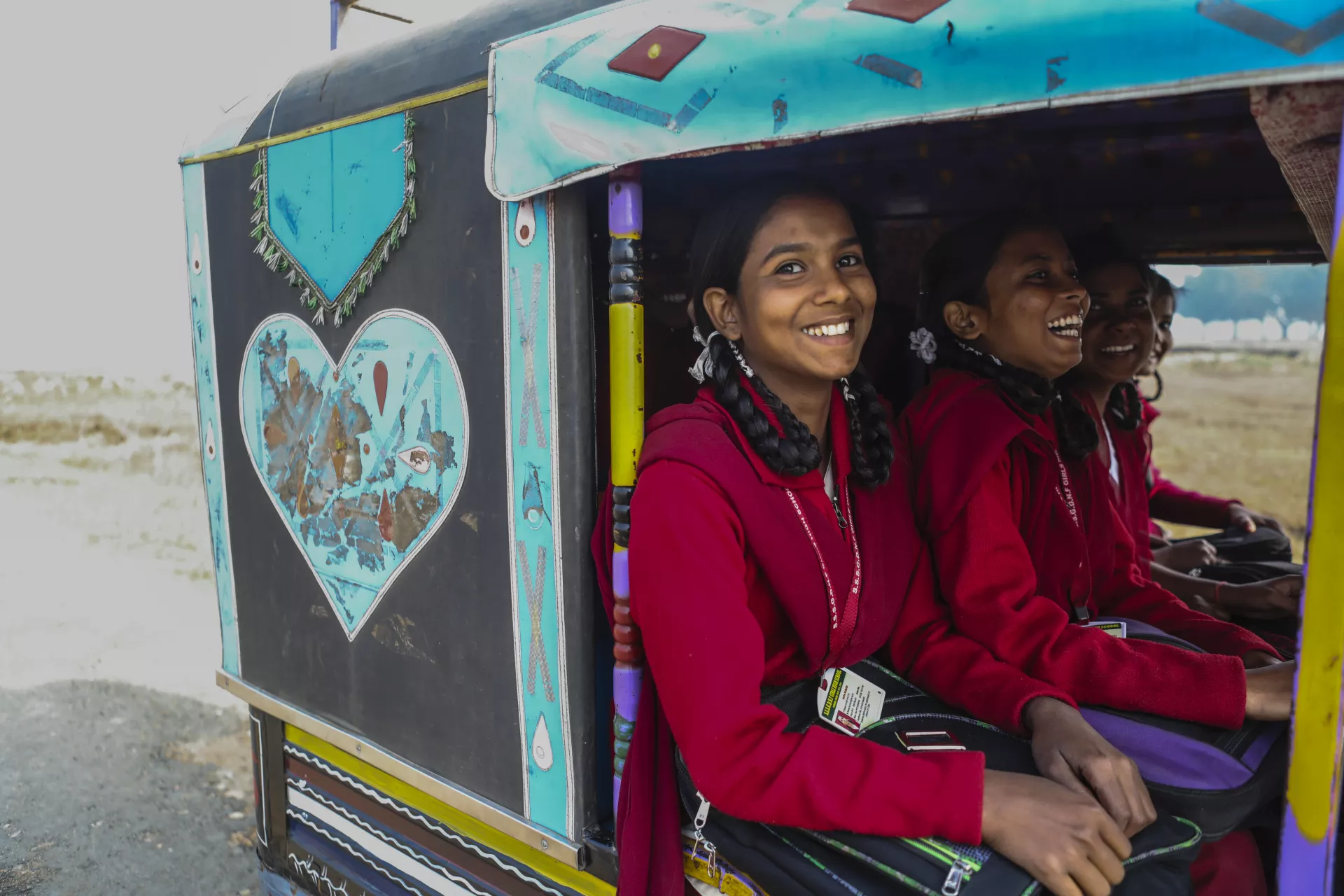 Vinita riding an auto with her school mates.