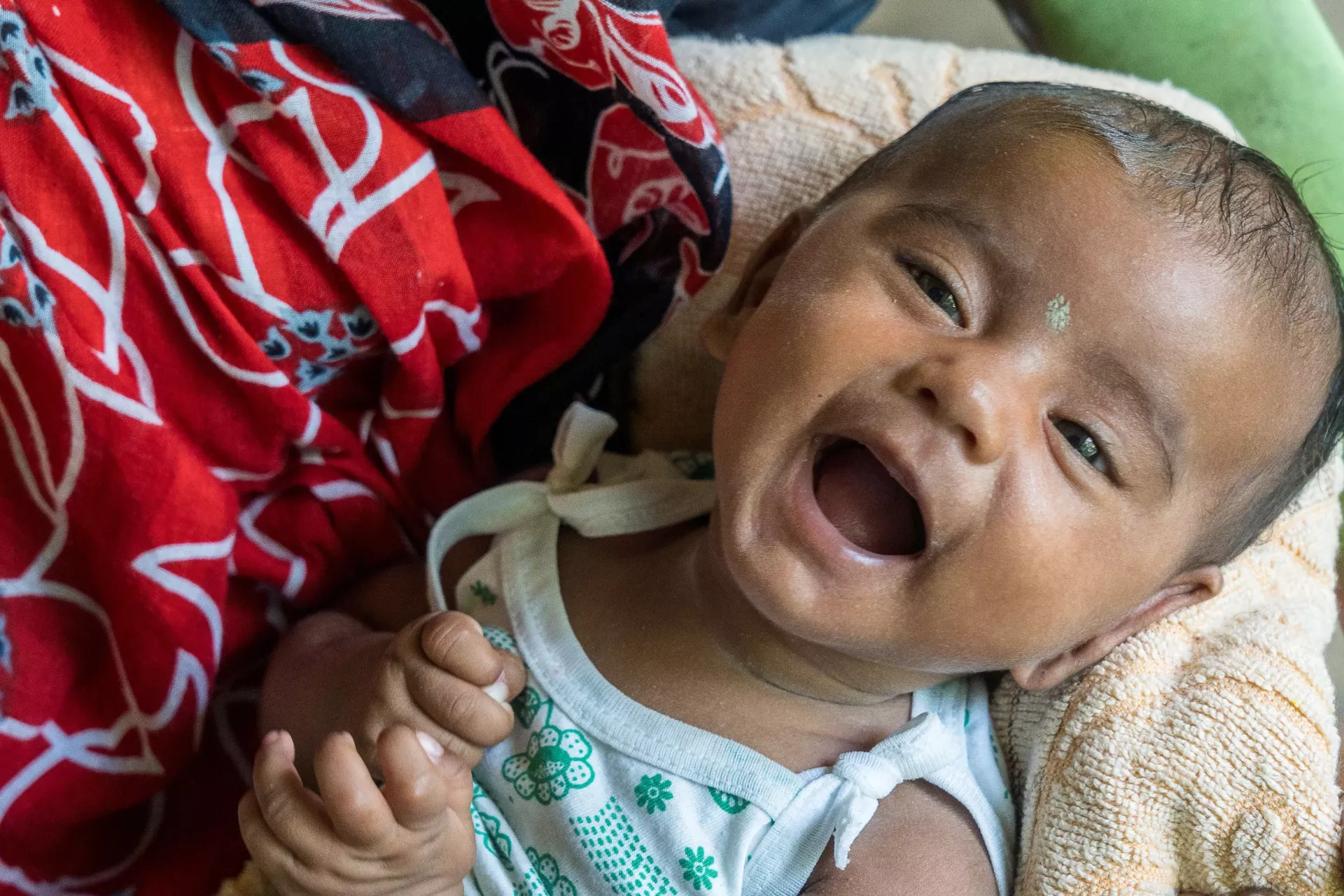 2 months old Pallabi came with her mother, Prabhati Jana Roy (25) at the outreach session site for routine immunization at Rabindra Sishutirtha primary school of Rakhalpur, one of the last inhabitable islands of Sundarbans at Patharpratima block of Diamond Harbour Health District.