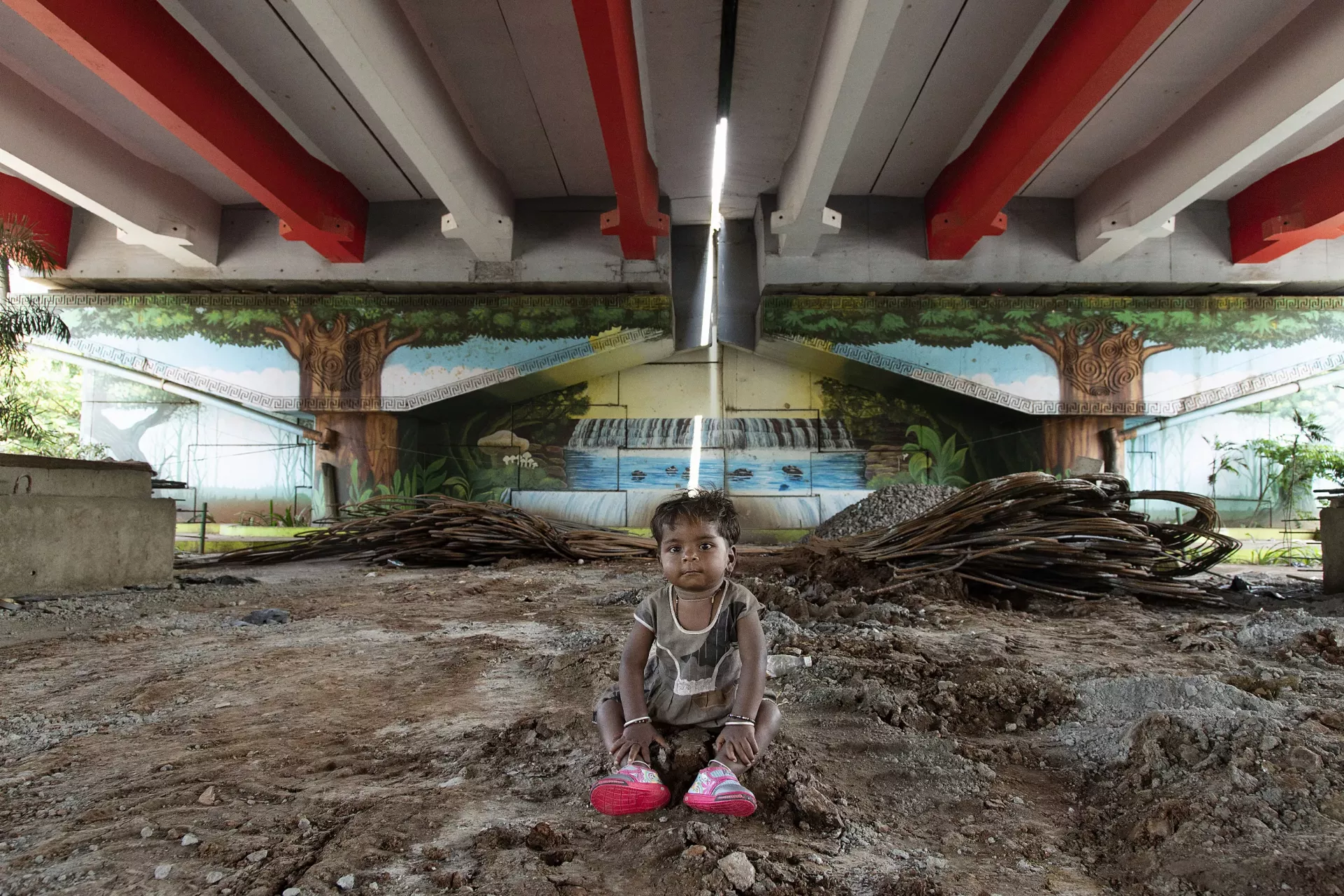 Shyam Vishal Kale, 2, sits under the flyover at Kherwadi, Bandra (E), Mumbai, India, on 17 October 2022.