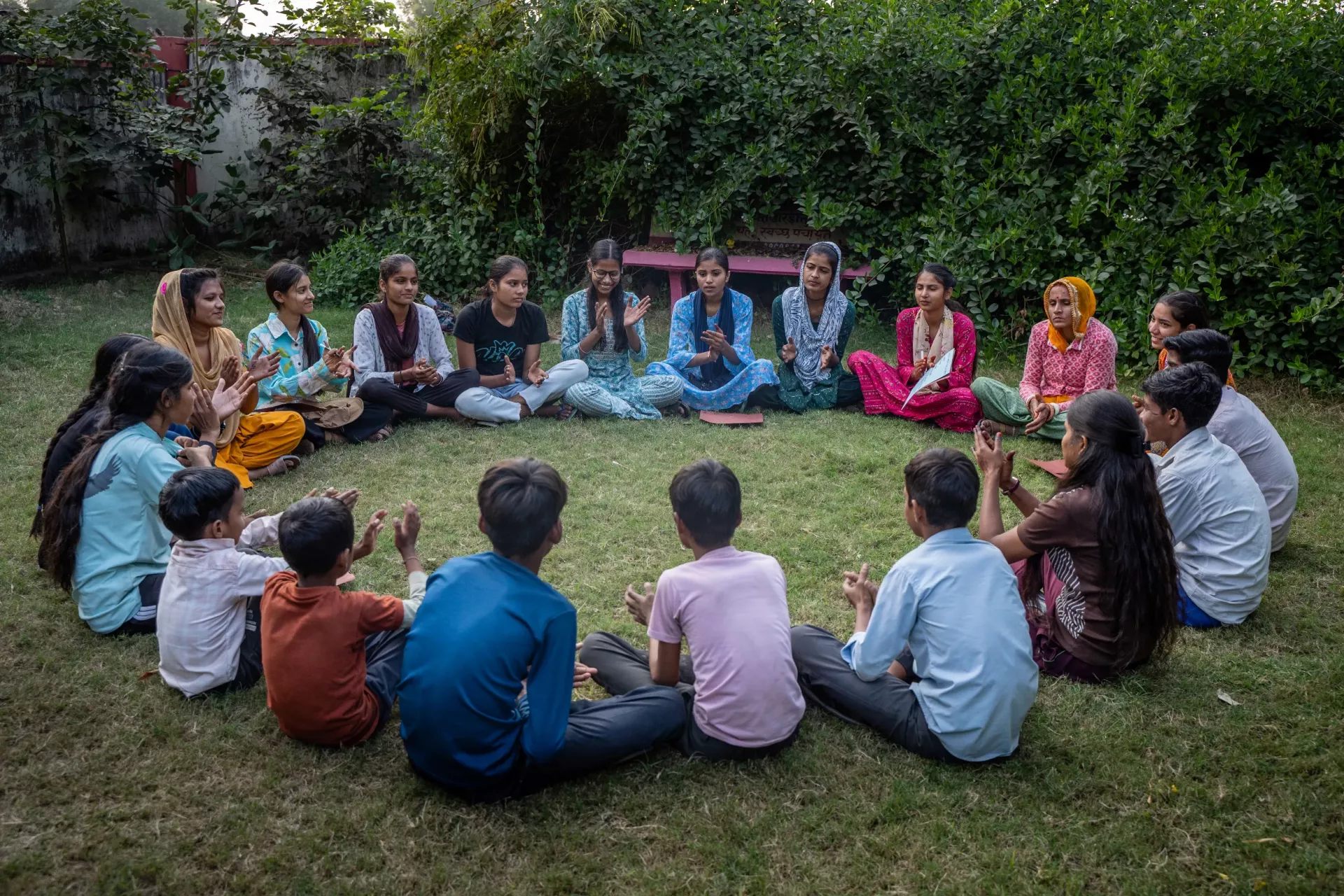 Members of the Adolescent  Girls Federation (AGF) and the Bal Panchayat, along with Saathin, are gathered for a meeting at the Gram Panchayat.