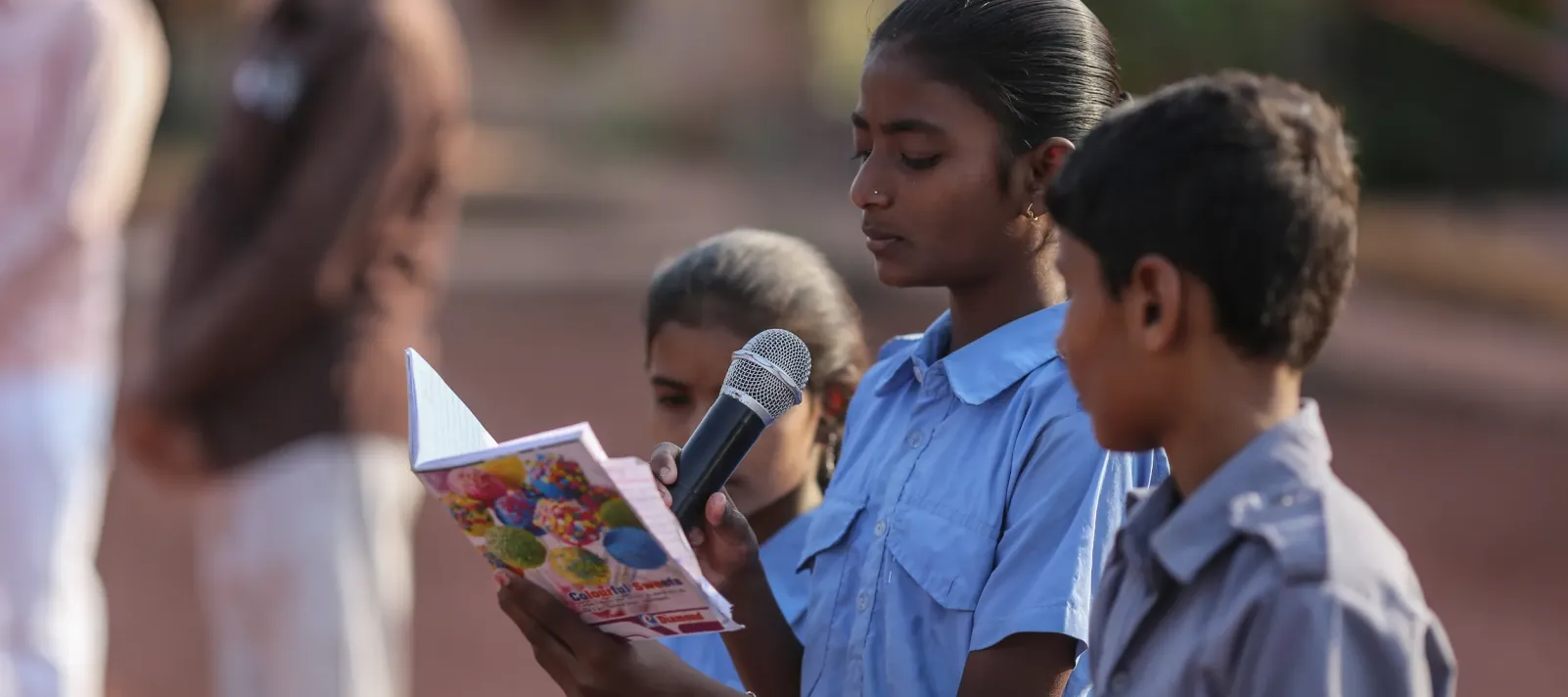Students sing a morning prayer during assembly at Zilla Parishad Primary School in Arni village, Dharashiv district, Maharashtra, India, on March 20, 2025.