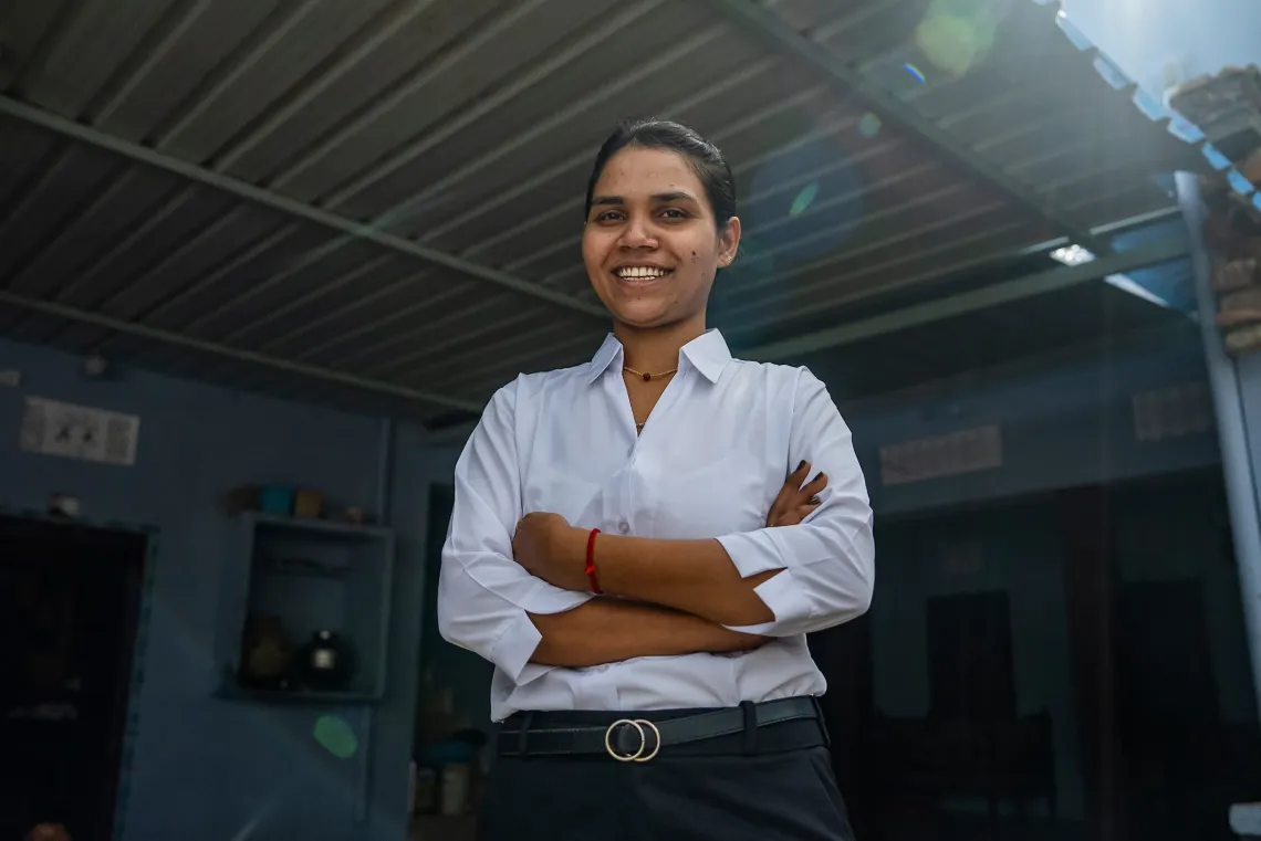 Monika Kaushal looks and smiles into the camera