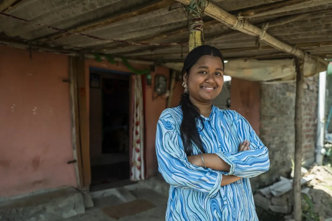 Savita Kumari smiles while looking into the camera
