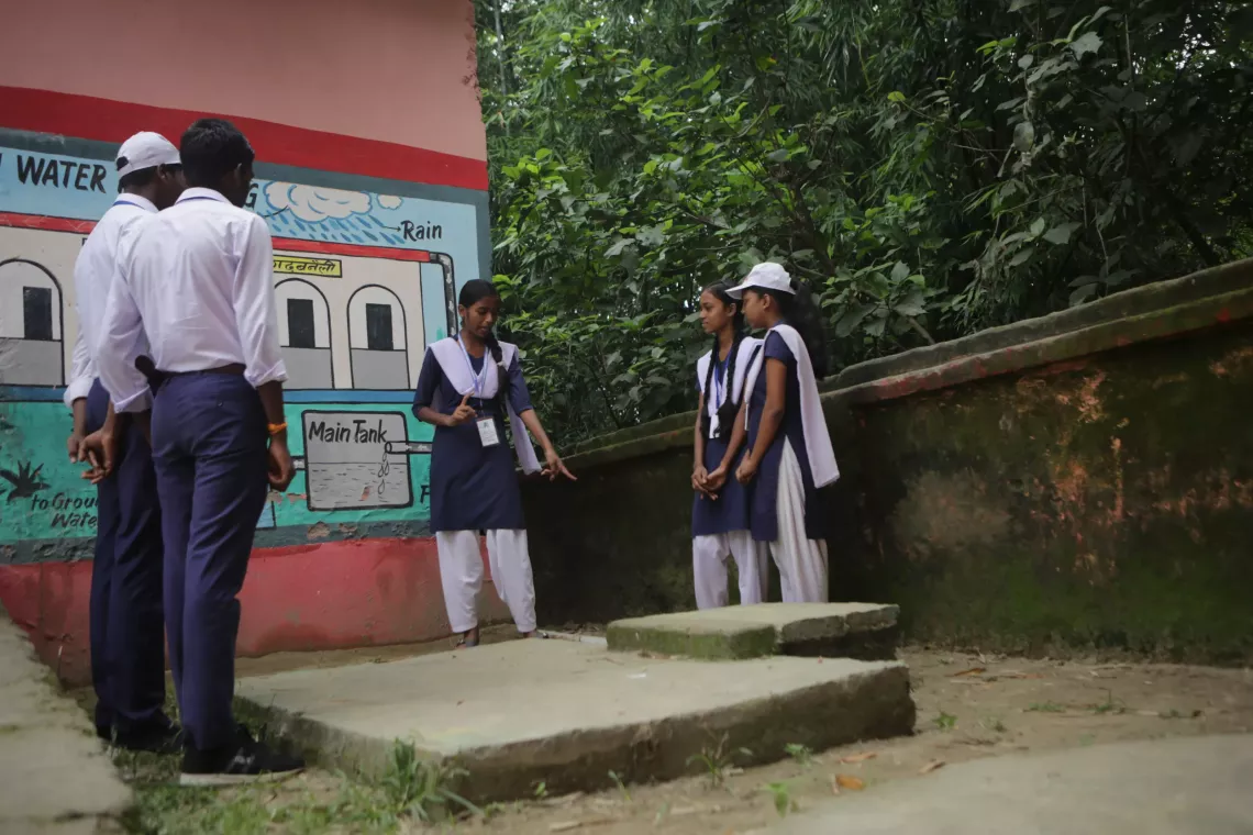 Students are learning about the rainwater harvesting system at Adarsh Ramanand Middle School in Garhbaneli.