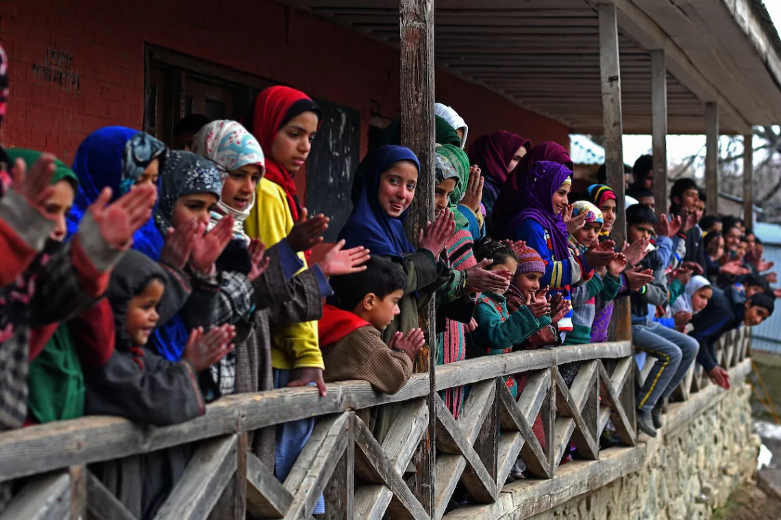 Children clapping outside the classroom.