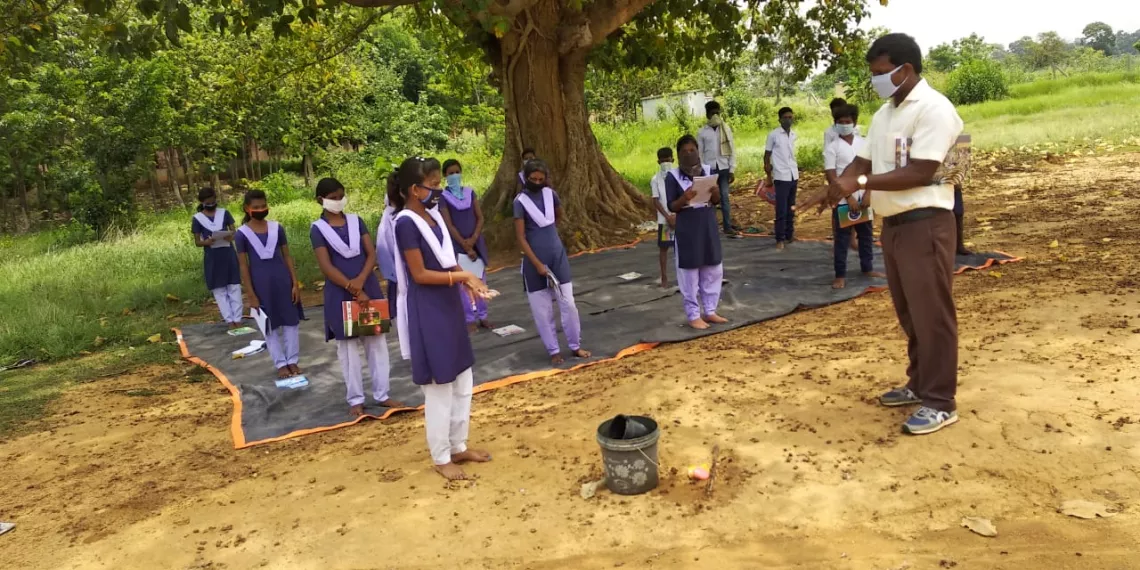 Students practicing five steps of hand washing at a tribal school in Nayagarh district of Odisha.