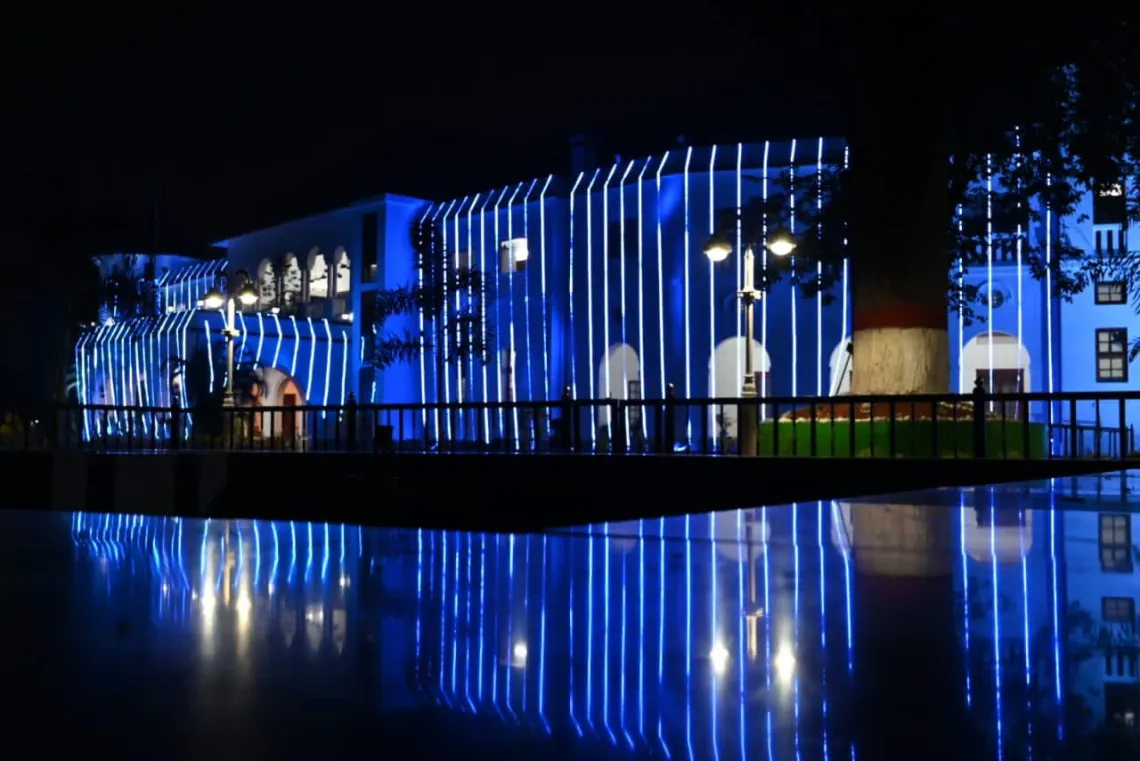 The outside of the governors house turns blue with lights