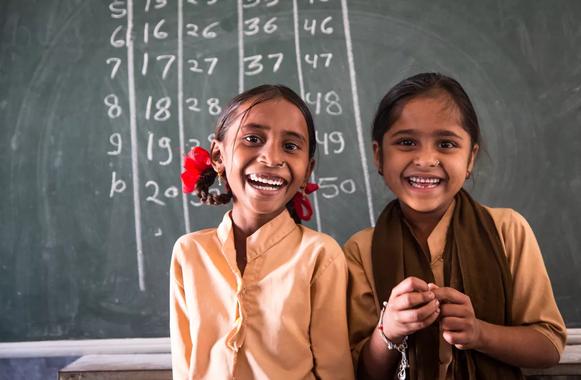 Seven-year-old Laxmi (left) with her best friend and classmate Swapna (right), also seven year old, studies in class 2 of the Government Secondary School in Chitri Block, Dungarpur District, Rajasthan.