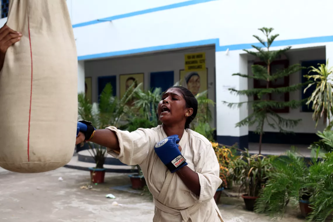 A senior girl practices boxing at the Kanyashree Club, Gouripur High School, Uluberia, Howrah, West Bengal, India.
