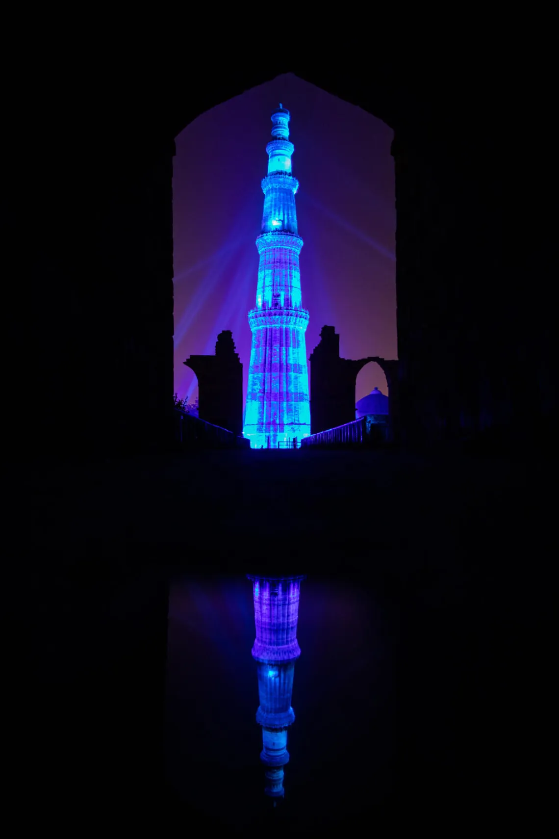 The Qutub Minar tower turns blue by lights