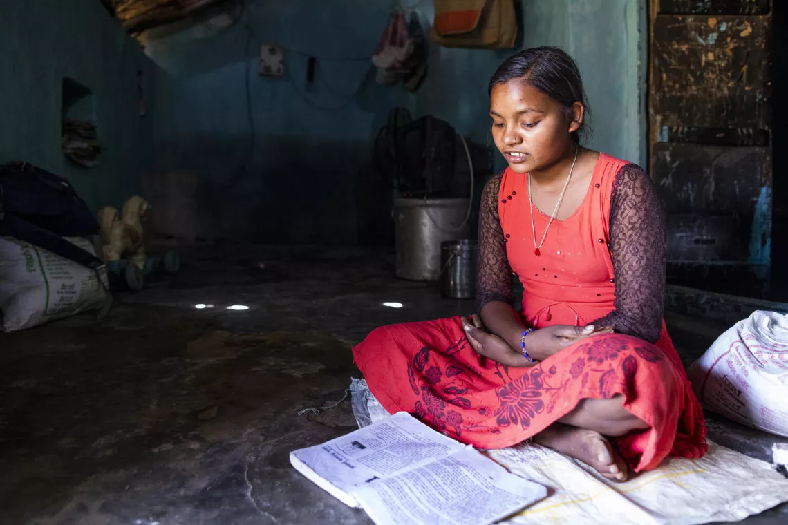 Reshmi, a class 10th student studies inside her house in Jamunhai, Chitrakoot. 