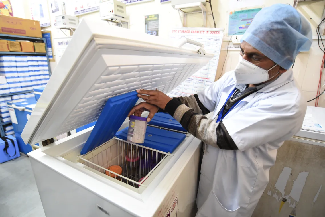 A health worker displays vaccine storage as part of the cold chain mechanism during a dry run held in Bhopal, Madhya Pradesh to prepare for India's COVID-19 vaccine campaign.