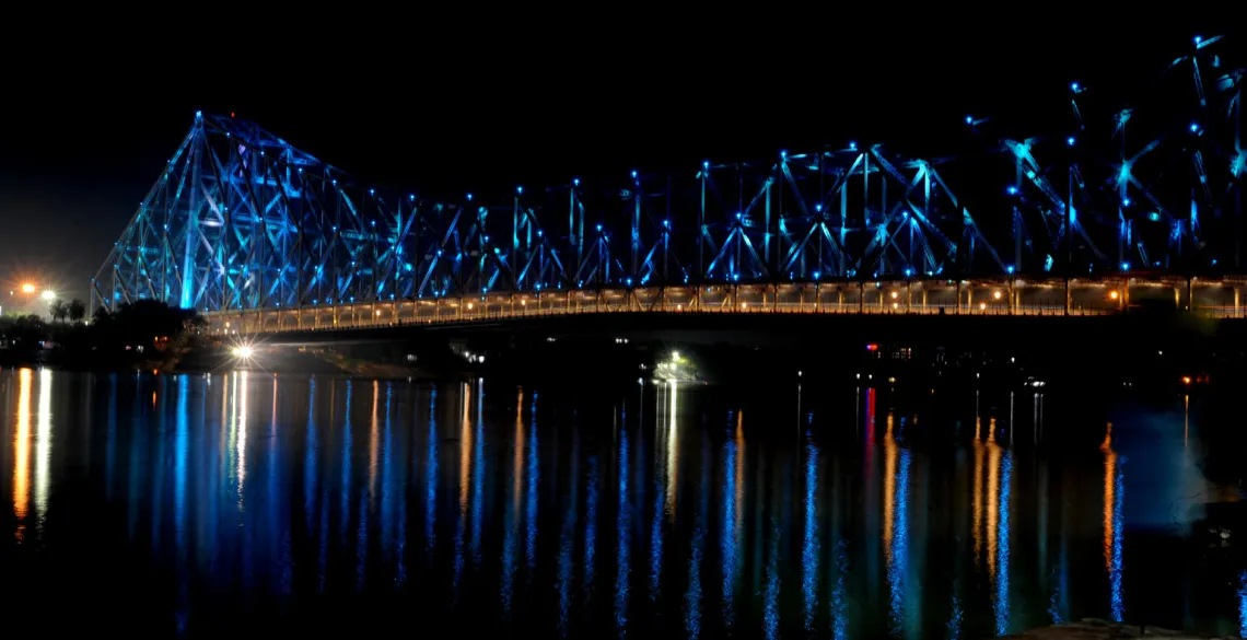 The iconic Howrah Bridge connecting the twin cities of Howrah and Kolkata in West Bengal turns blue on World Children's Day.