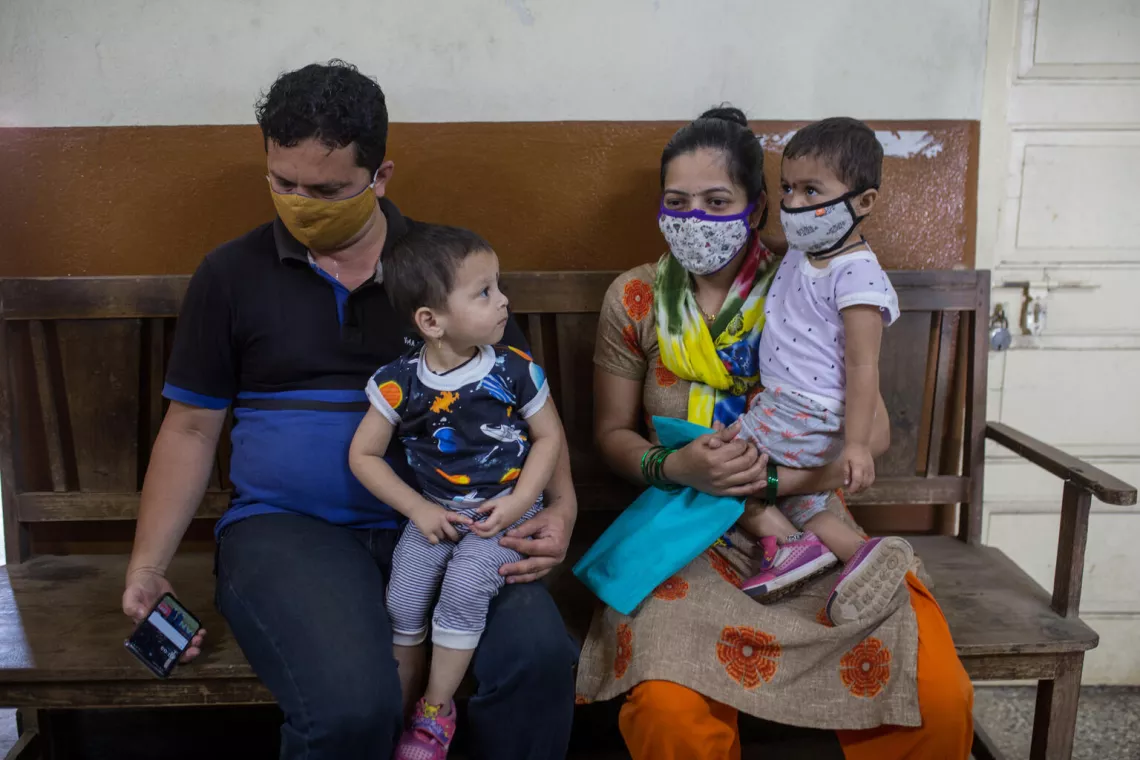 Parents and their twins wait for their routine immunization at Givernment hosiptal in wens 
