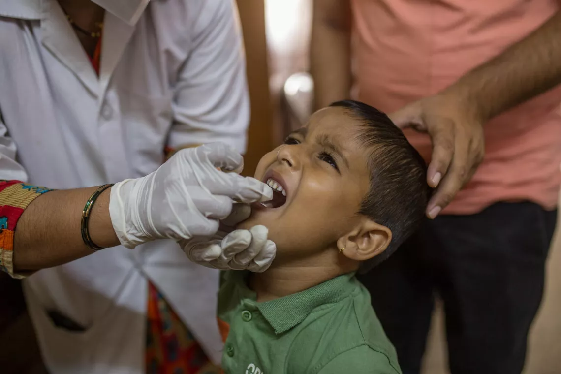A health worker immunizes a child at a routine immunization session at Government hospital in Indian state of Maharashtra