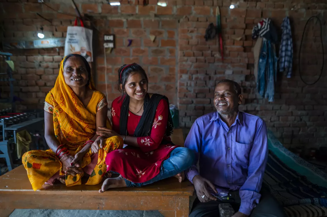 5 years old Aarti reacts as she interacts with her parents at her house at Amini in Varanasi, Uttar Pradesh.