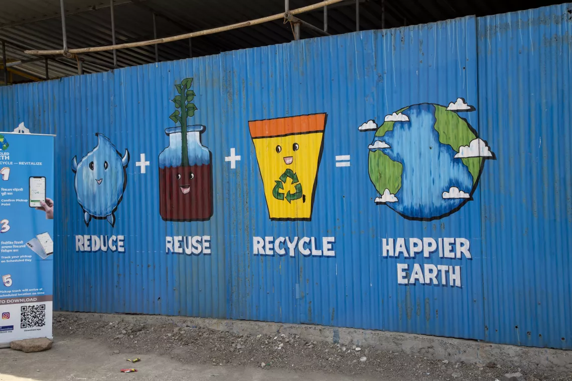 18, APRIL, 2022: A view of a brightly coloured hand painted recycling mural on the wall at Samarth Bharat Vyaspeeth (SBV), a social organisation, in Thane, Maharashtra 