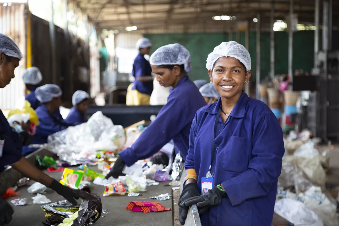THANE, MAHARASHTRA - 18, APRIL, 2022 : Poonam Mangesh Ghor, 25, pictured while segregating collected dry waste at the waste management centre Samarth Bharat Vyaspeeth (SBV), a social organisation, in Thane, Maharashtra , India on April, 18, 2022.