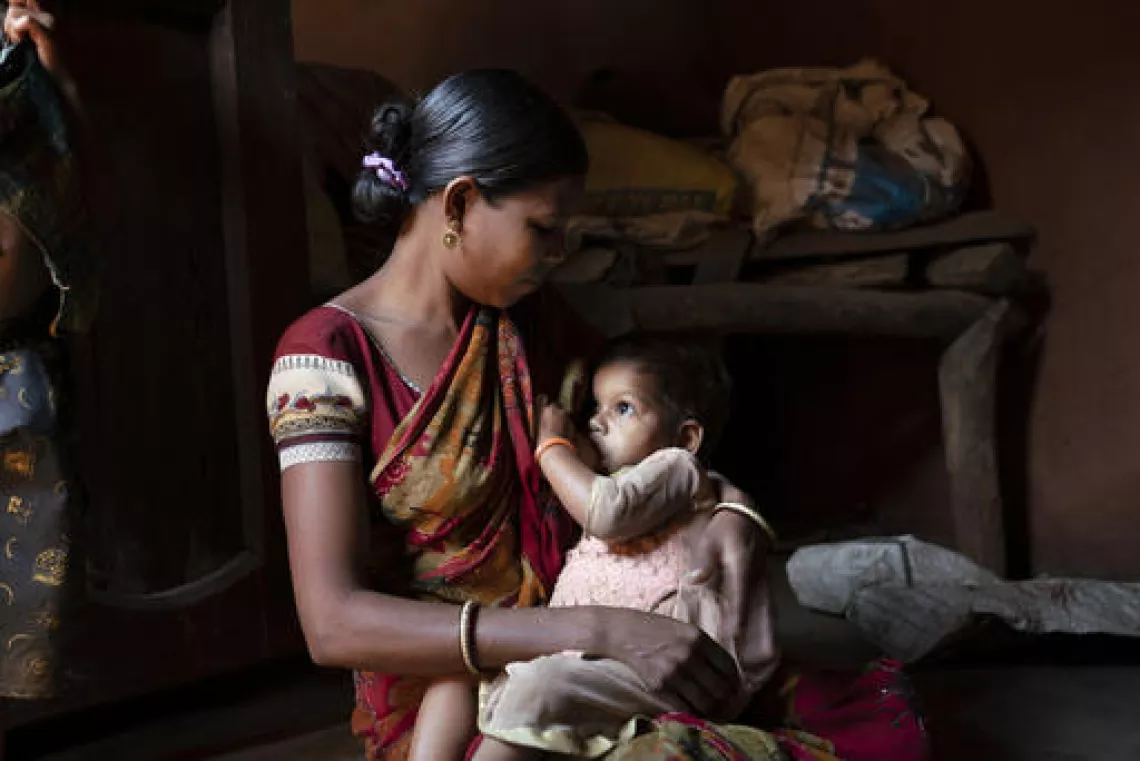 Budhe Majhi breastfeeding her nineteen-month-old daughter old daughter Priyanka