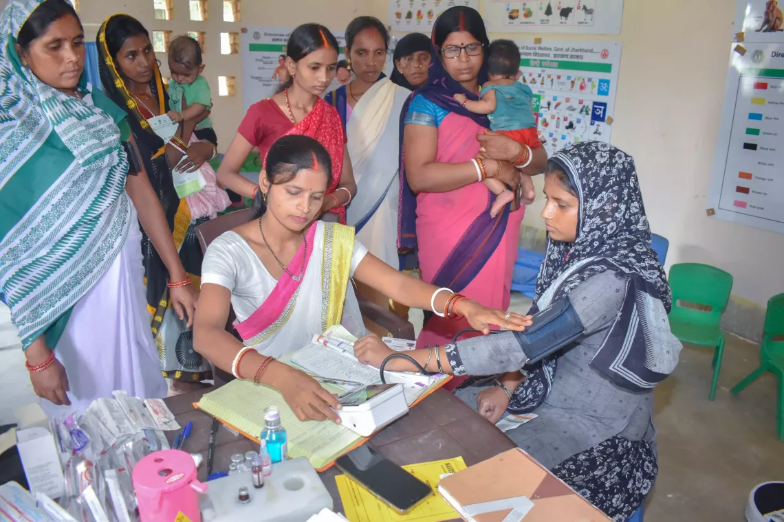With new session site pregnant mothers are also receiving ANC (Antenatal care) services. Service provided by ANM (Auxiliary Nurse Midwifery) Sandhya Kumari at the routine immunization session site in Village Tulsidih, Jharkhand.