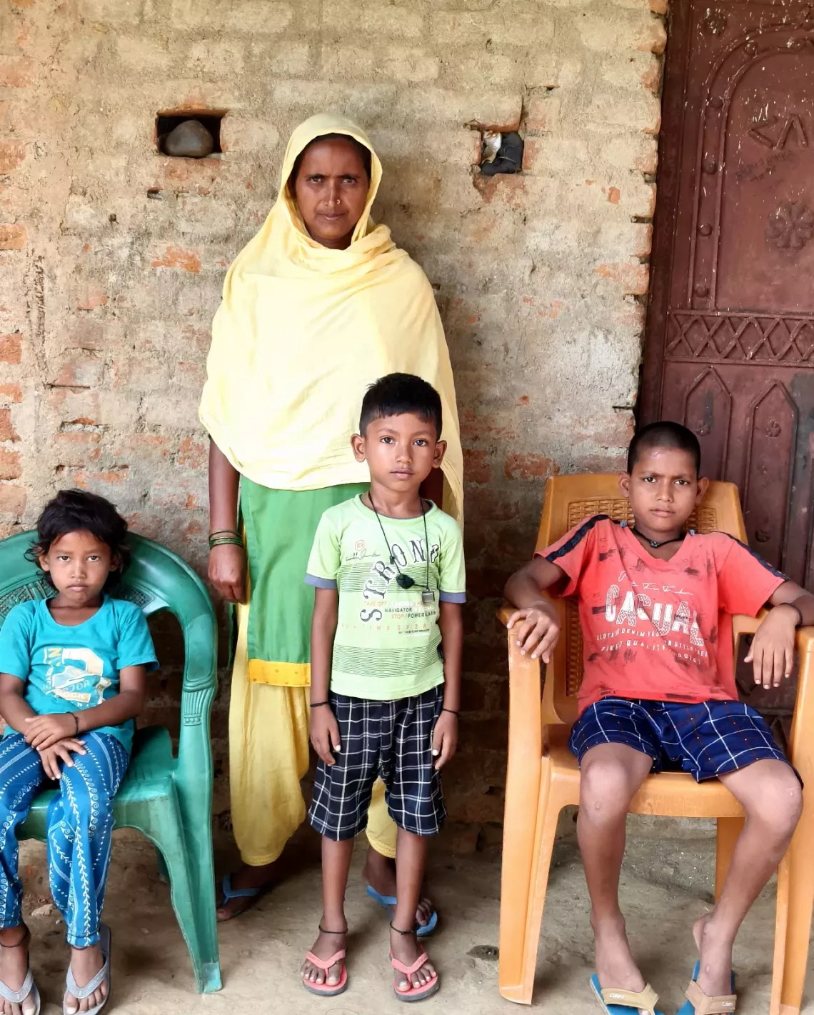 Farida Khatoon with her three children who were affected during Measles outbreak in village Tulsidih, Jharkhand.