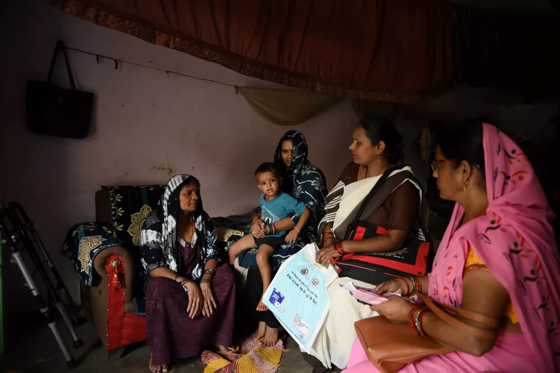 In this heartwarming scene, Pratik, a two-year-old boy, is comfortably seated in his mother Pushpa&rsquo;s lap, alongside his grandmother, Saraswati. 