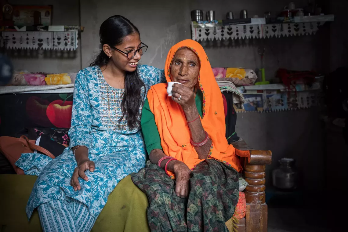  Vasundhara Prajapat is seated with her grandmother, Badam Devi Prajapat. Her grannndmother has played a vital role in Vasundhara's journey.