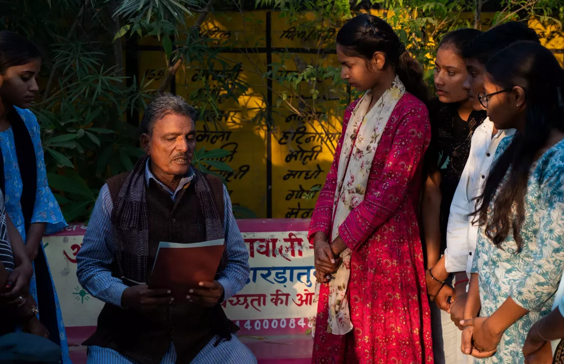 Sarina Banu, President of Bal Panchayat presenting the issues raised in the meeting with the members of Bal Panchyat and AGF to the Sarpanch, Abdul Karim. 