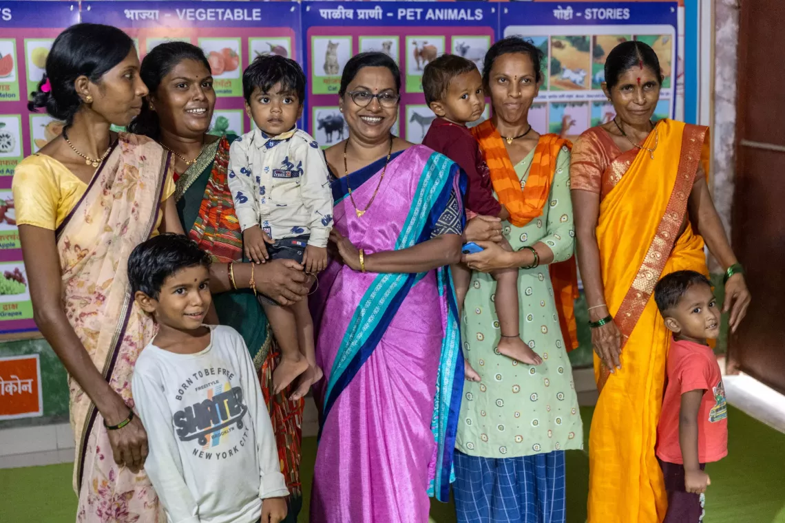 (From left to right) Mangala Vinod Wankhede along with her five year old son Chaitanya, Meena Sagar Kukde, along with her two year and nine months old son Yugan, Anganwadi worker, Ranjita Rupesh Moon, Sarita Parmeshwar Bhabhale, along with her two years and six months old son Rudhra and Kousal?Maruti?Nehare along with her three year old grandson Danish Roshan Nehare, pose for the photograph at the Anganwadi no 74, Warud village, in the District of Amravati, Maharashtra , India, 22 October 2024.