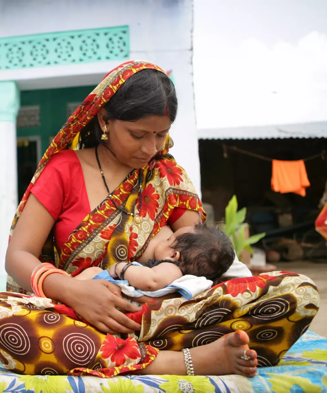 Seema Bai, 21 years old mother breast feeding her 2 months old baby boy Yash. 