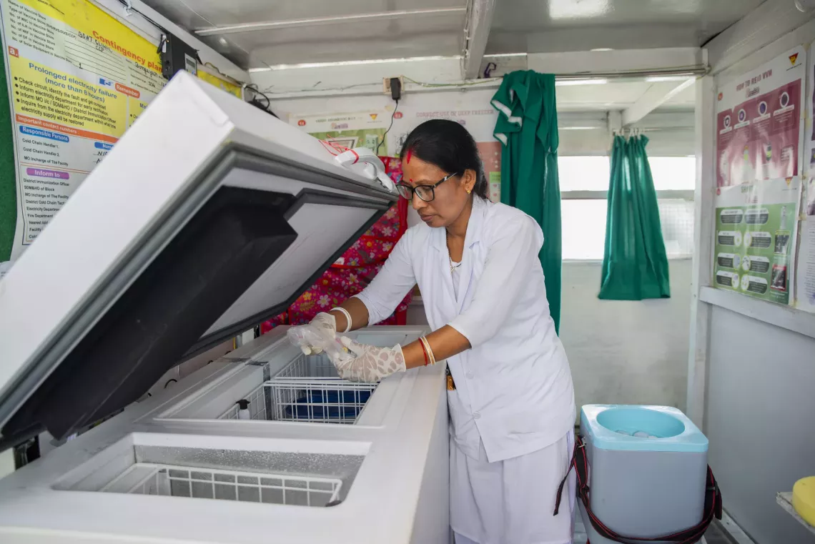 Onboard the Boat Clinic is a veteran nurse and midwife 41-year-old Nirupoma Roy,  handling the vaccines on the cold chain, and preparing for the makeshift health clinic to be conducted at Noor's village in Khorchimari Island