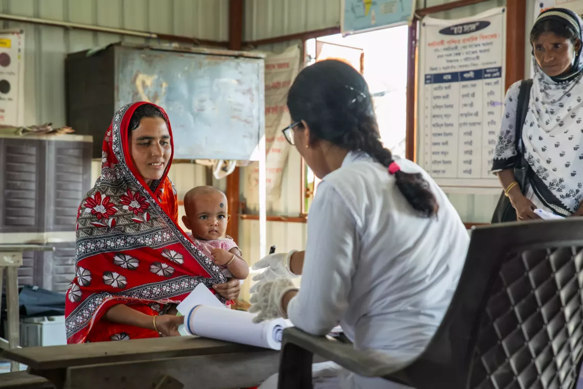 9-month-old Noor Khatoon along with her mother Munawara Khatoon has come to the Boat Clinic to get vaccinated against measles, rubella and Japanese encephalitis.