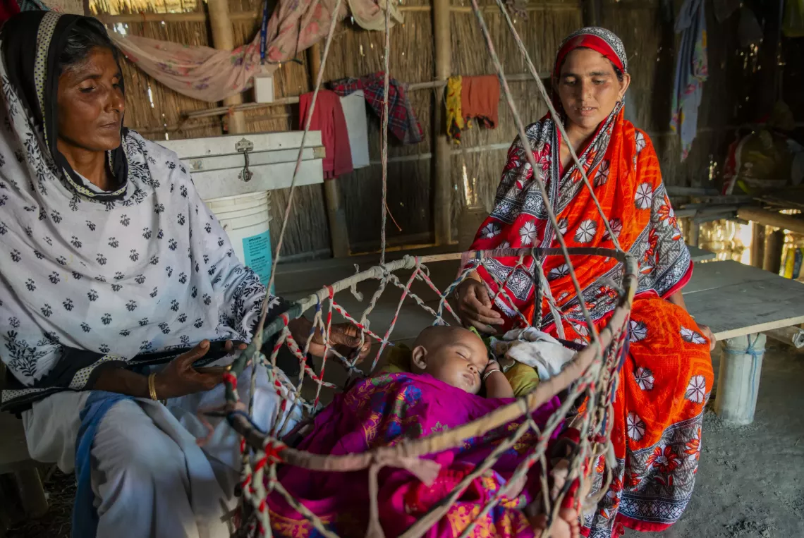 Noor's mother, 25-year-old Munawara Khatun, is waiting for boat clinic