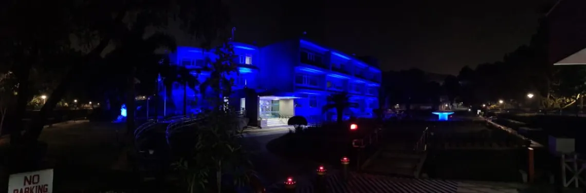 The outside of the UNICEF India Office in Delhi is blue with lights