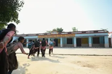 On a bright, sunny day at Purv Madhyamik Vidyalaya, cheerful students can be seen running toward their classrooms with excitement, eager to start their day. 