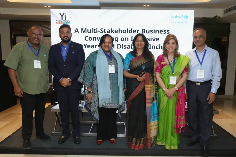 Six dignitaries pose together on stage at a UNICEF India event titled "A Multi-Stakeholder Business Convening on Inclusive Early Years and Disability Inclusion." The backdrop displays logos of Young Indians (Yi) and UNICEF. The participants include business, healthcare, and civil society leaders gathered for the launch of the II4E platform.