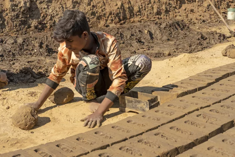 Portrait of Dalpesh Devada 15 &ndash; year &ndash; old works at the brick kiln.