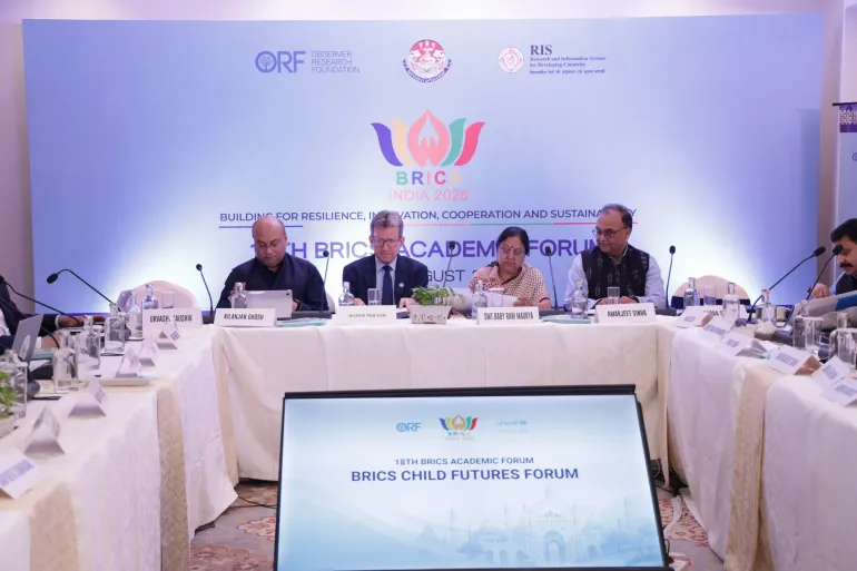 Senior officials seated at the BRICS Child Futures Forum panel, including Jesper Moller of UNICEF India and Cabinet Minister Smt. Baby Rani Maurya, in front of the BRICS India 2026 backdrop.