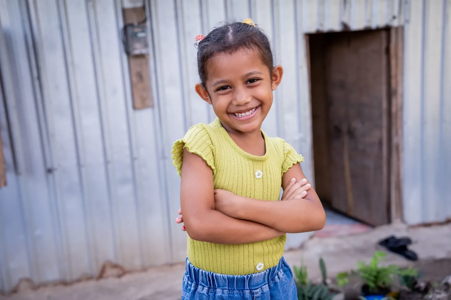 Ceila, 5, in front of her home in West Manggarai, East Nusa Tenggara Province, in May 2025.
