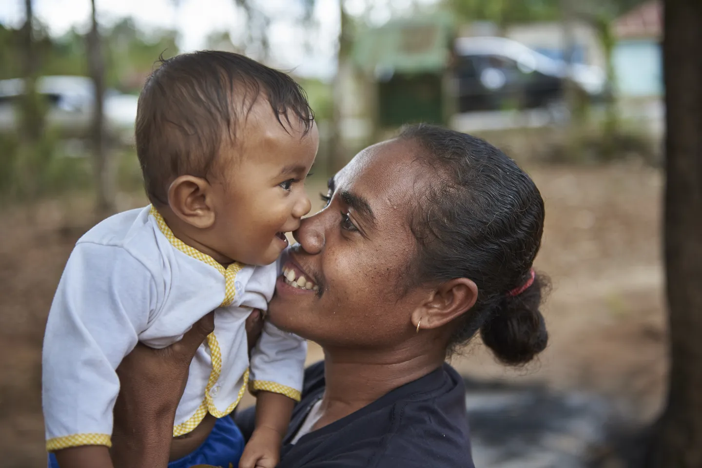 A mother holding her son