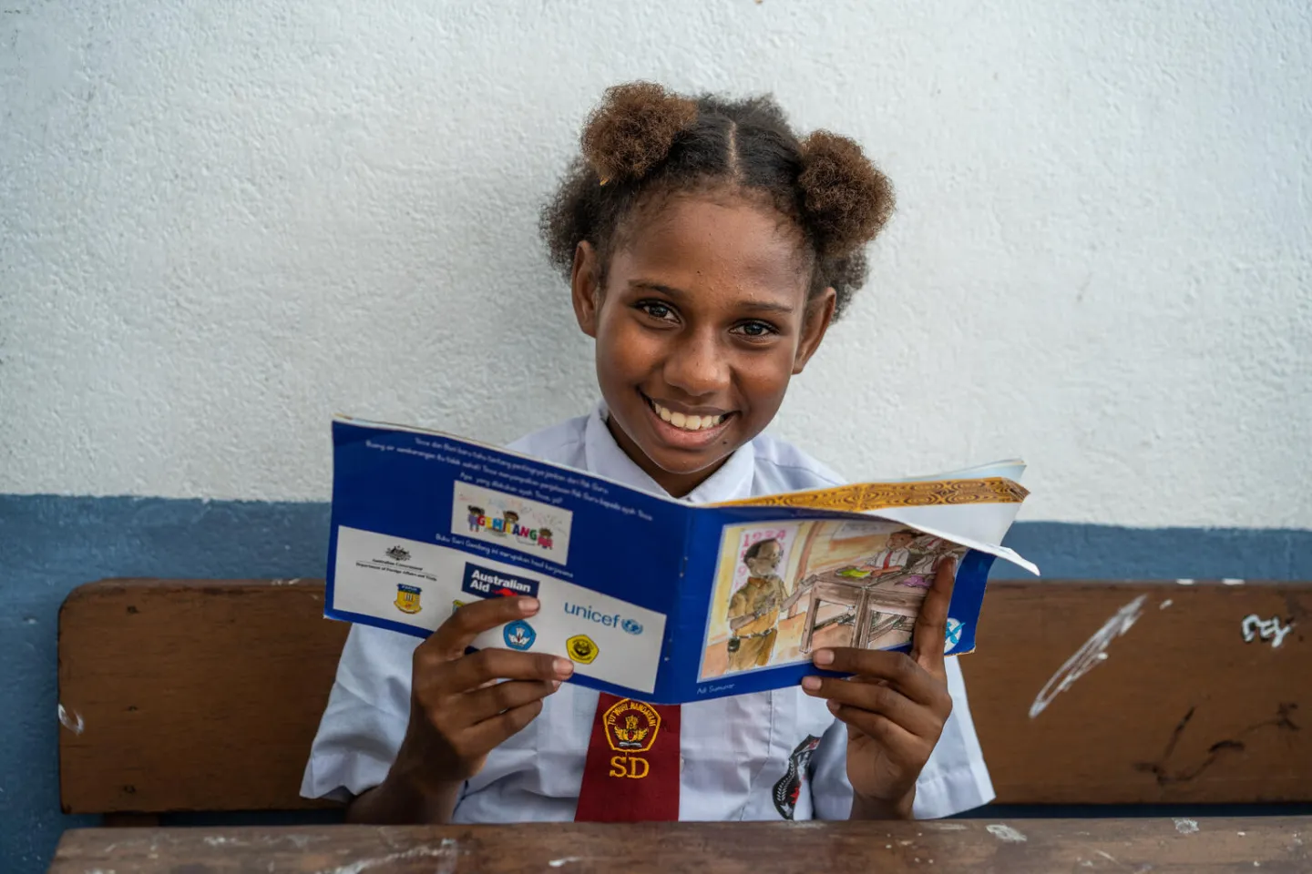 A student reads a story book