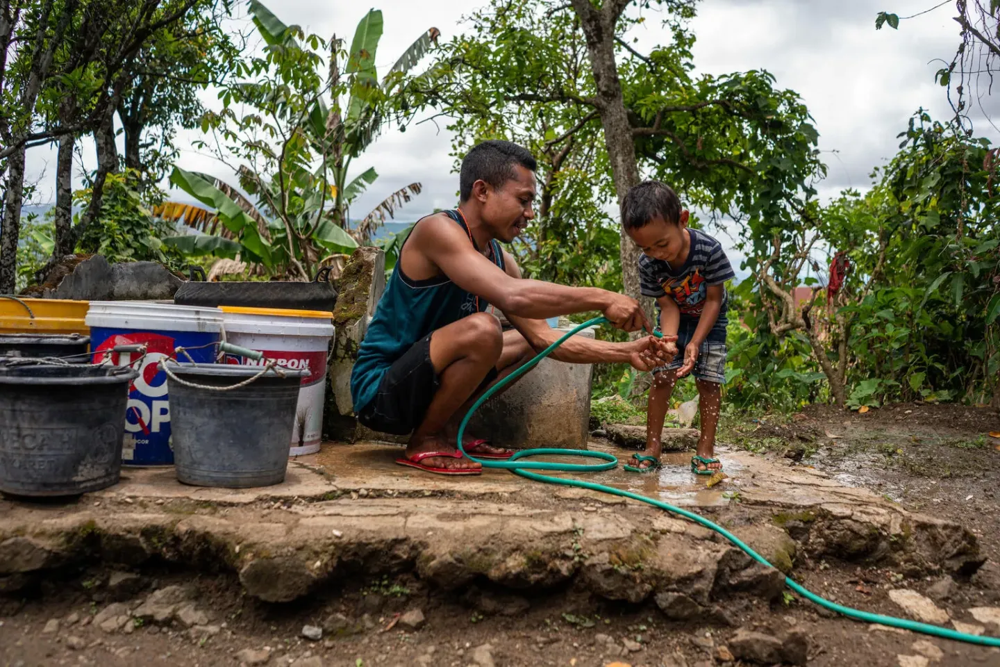 A man helps his nephew cleans up