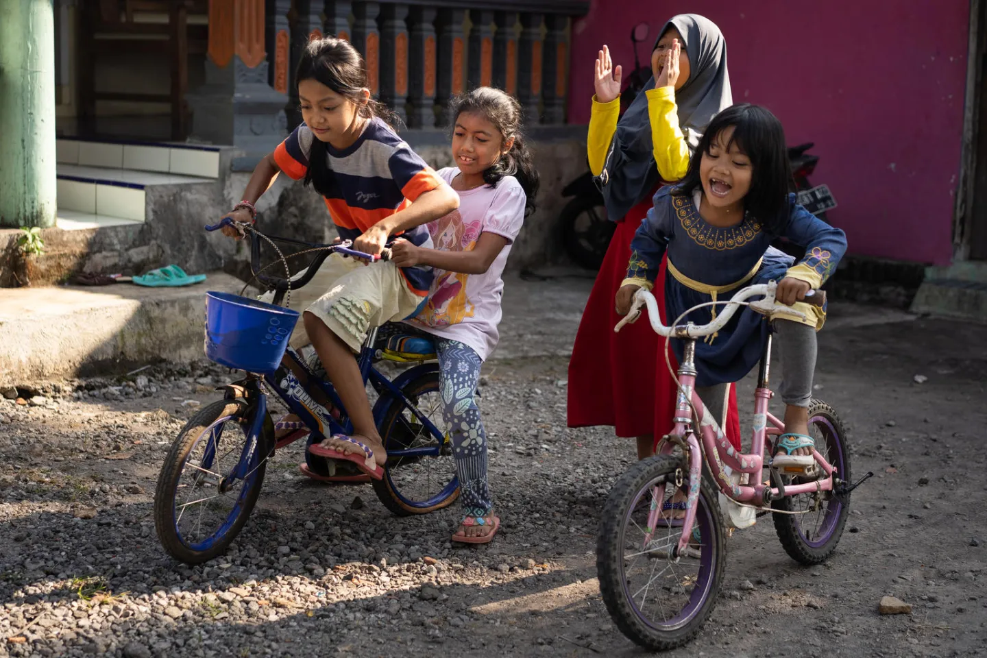 Children are playing in their neighborhood.