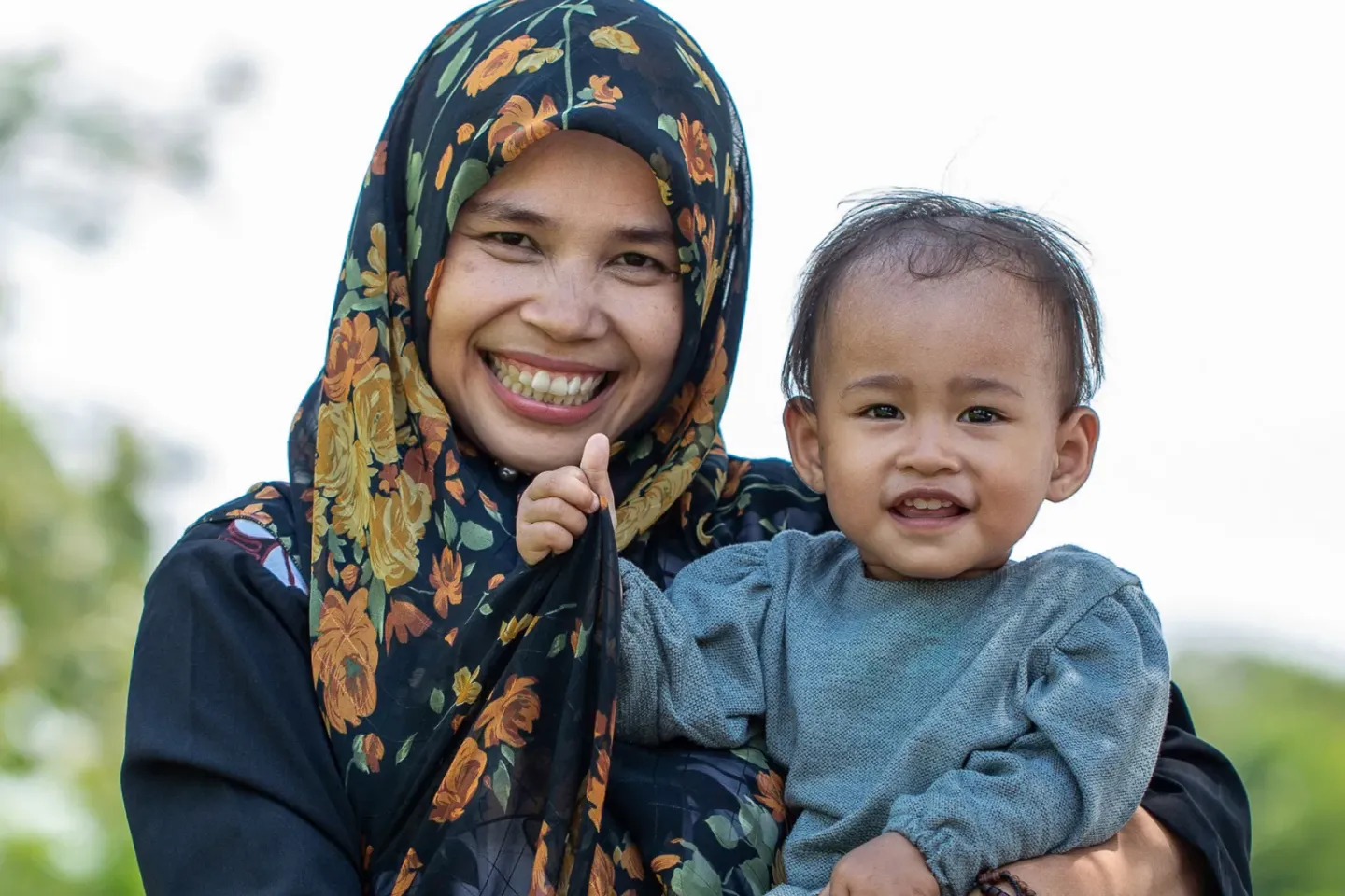 A mother holding her baby