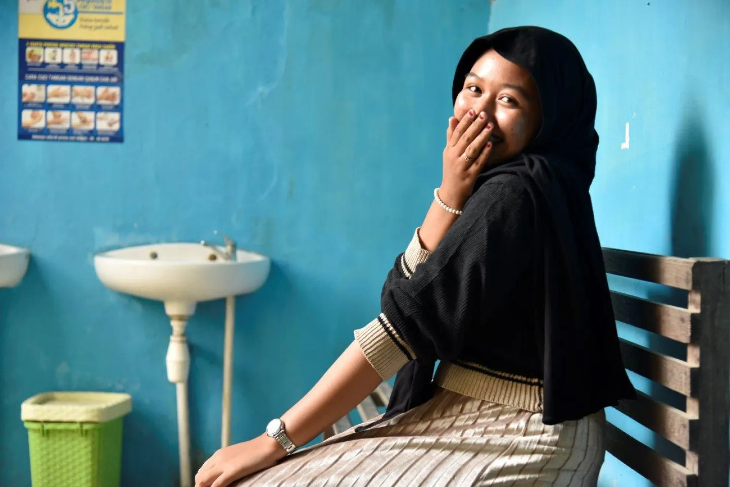 Annisa smiles to the camera