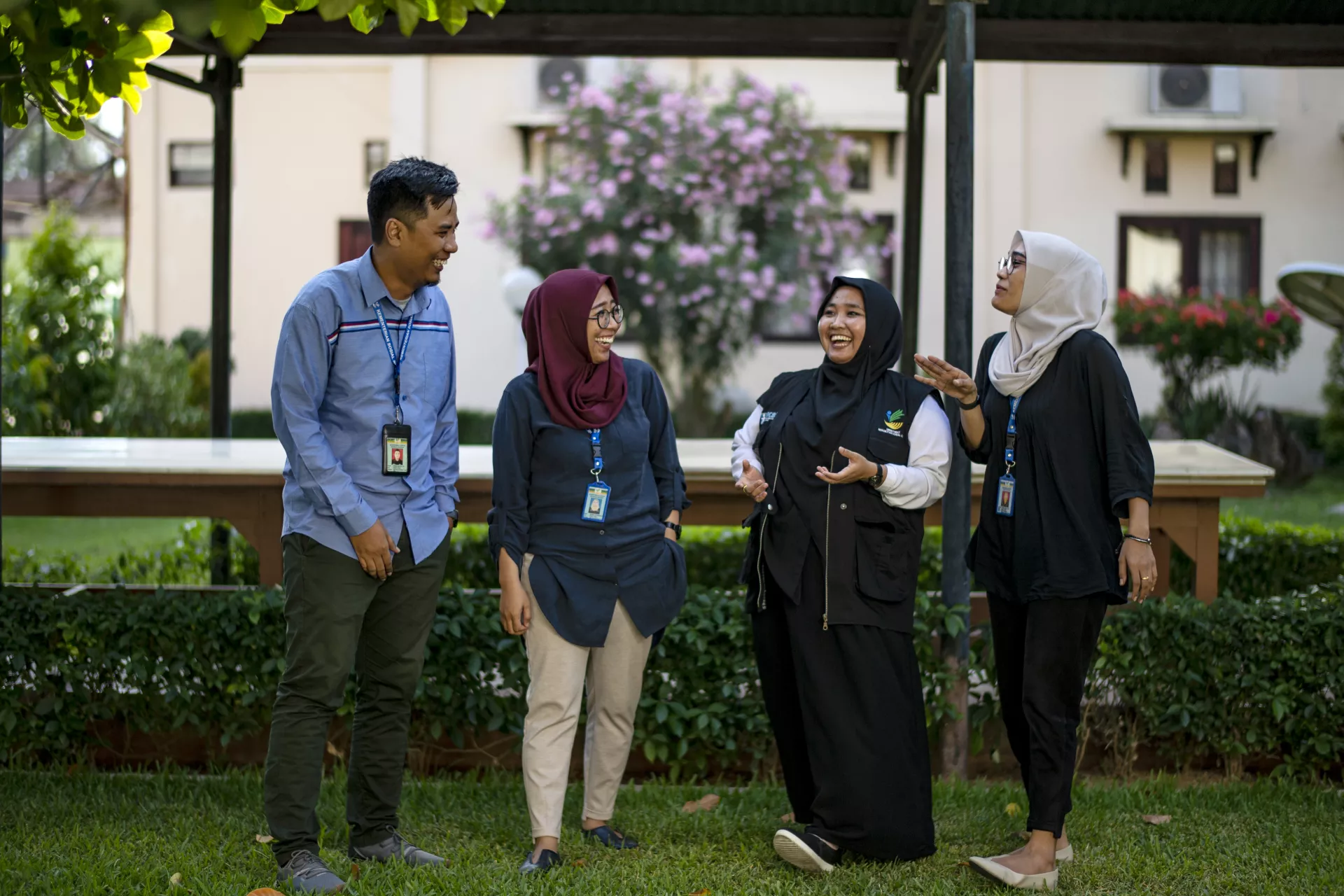 Robby Saputra (33), Ramadhani Sri Handayani (32), Nurfanny (30), and Triyana Sari (30) pose in front of the camera in the park in the Social Office office area in Palu, Central Sulawesi, Indonesia, on 11 September 2019. 