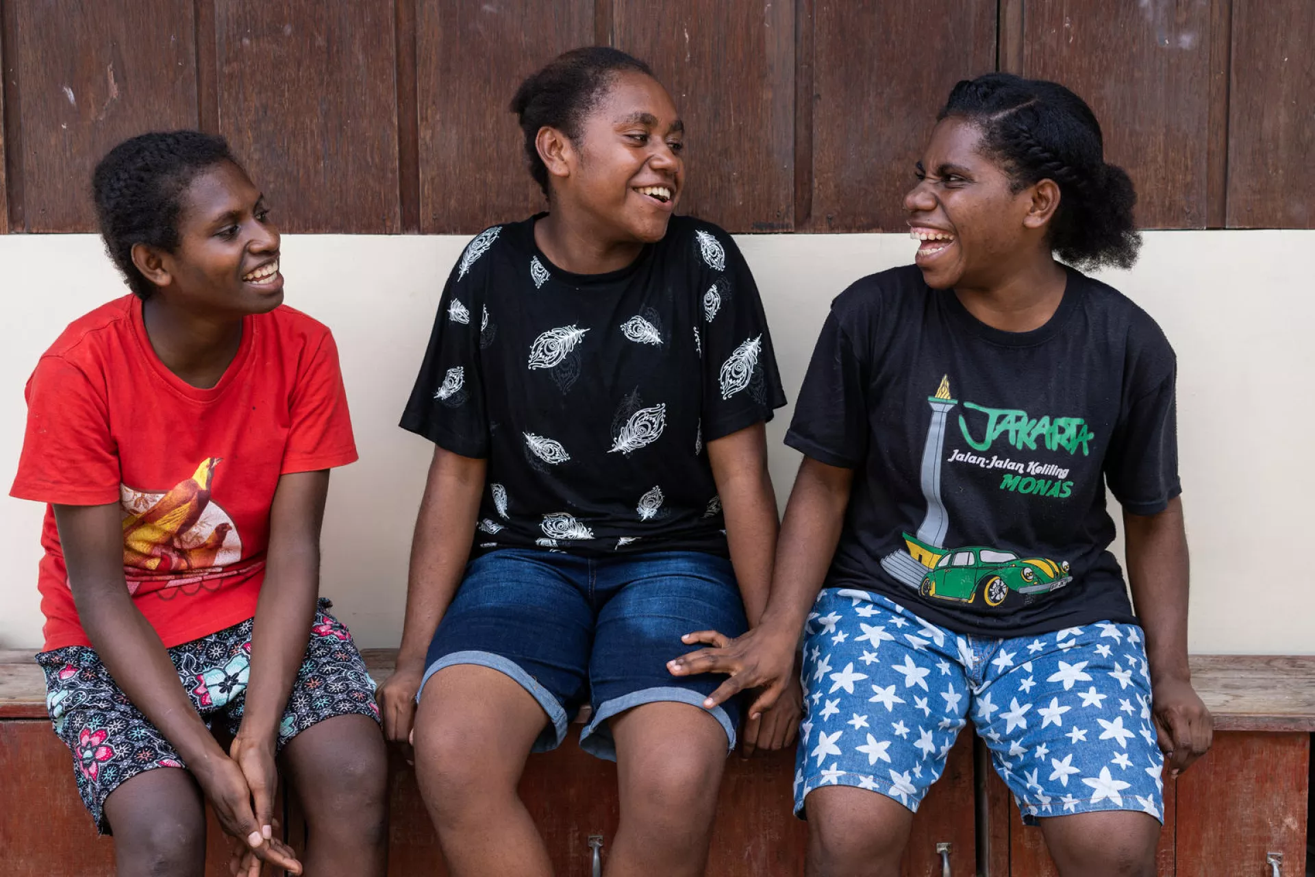 Three adolescent girls talking