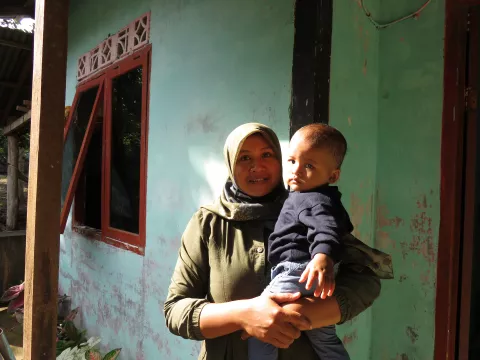 A 10-month-old baby with his Mother.
