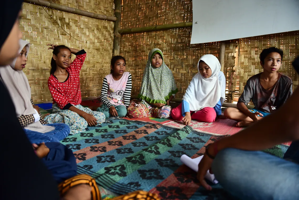 Children play together at the child protection post in Senaru Village, North Lombok, West Nusa Tenggara.